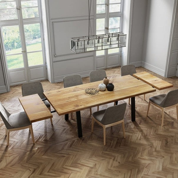 Solid Extendable oak dining table with pin legs displayed in a modern dining room interior.